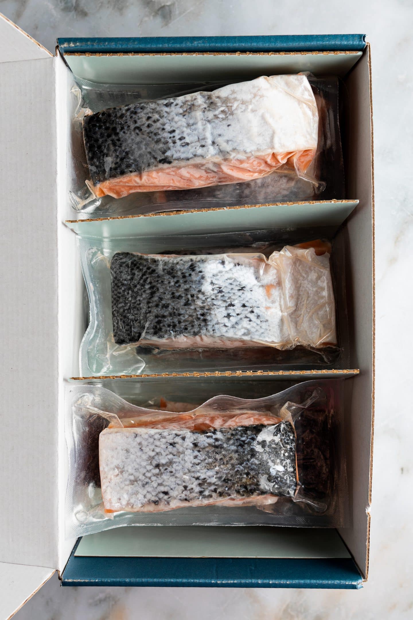 Box of secret island salmon, pre portioned, frozen.