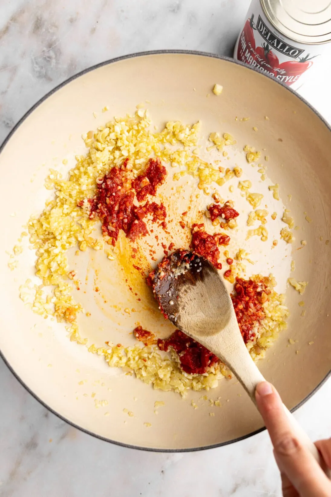 step by step: cooking the tomato paste with the garlic and shallot
