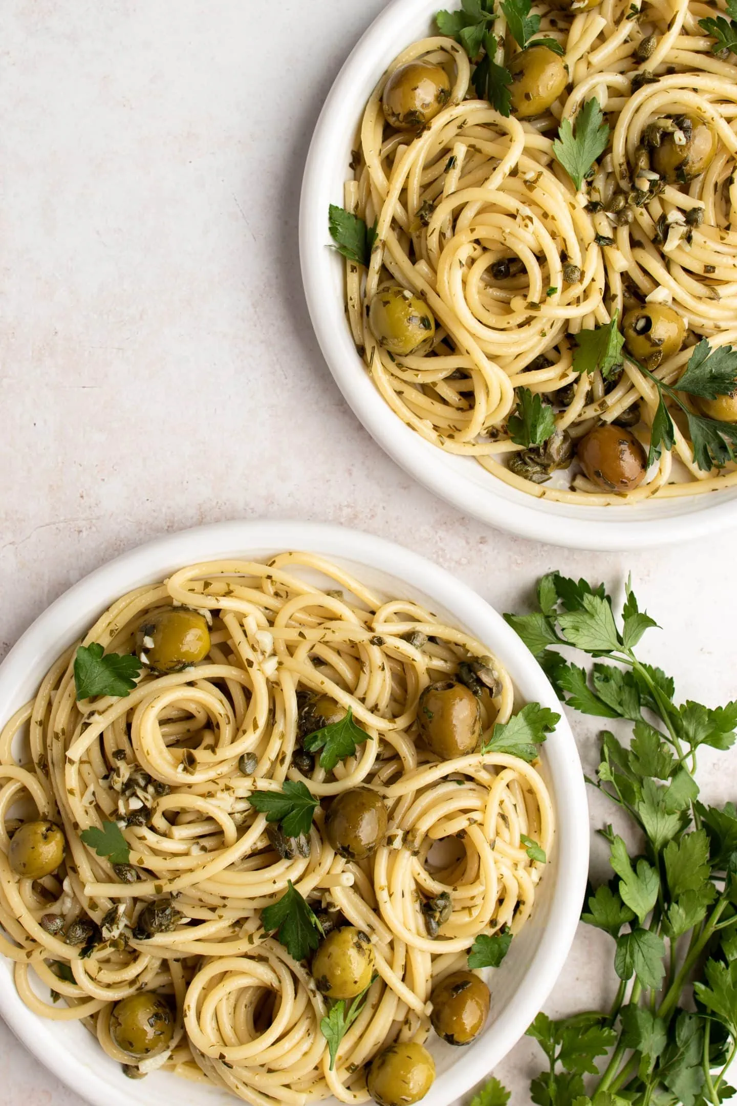 plates of green olive pasta
