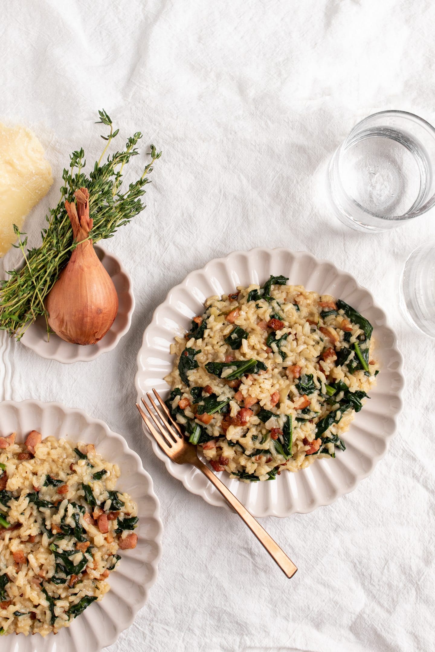 plates of kale and pancetta risotto
