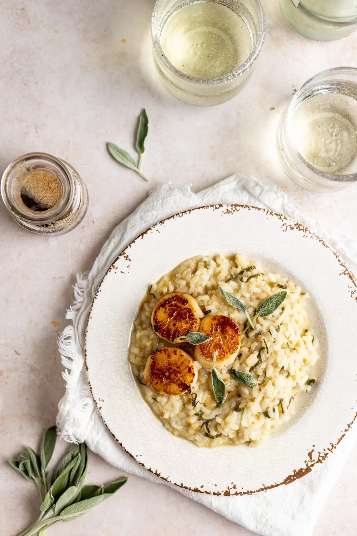 brown butter and sage risotto topped with seared scallops, brown butter and sage.