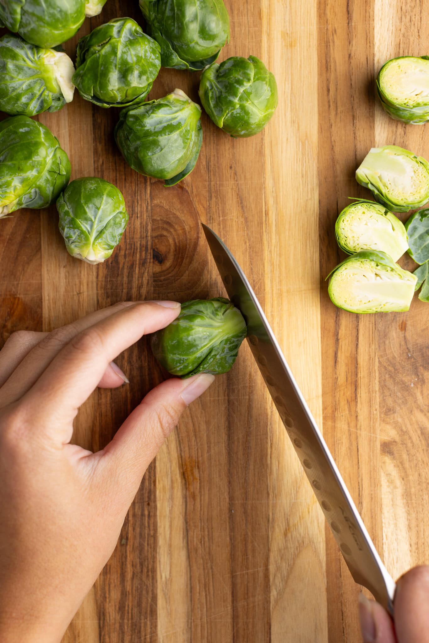 step by step: cutting the bottom stem off a Brussel sprout