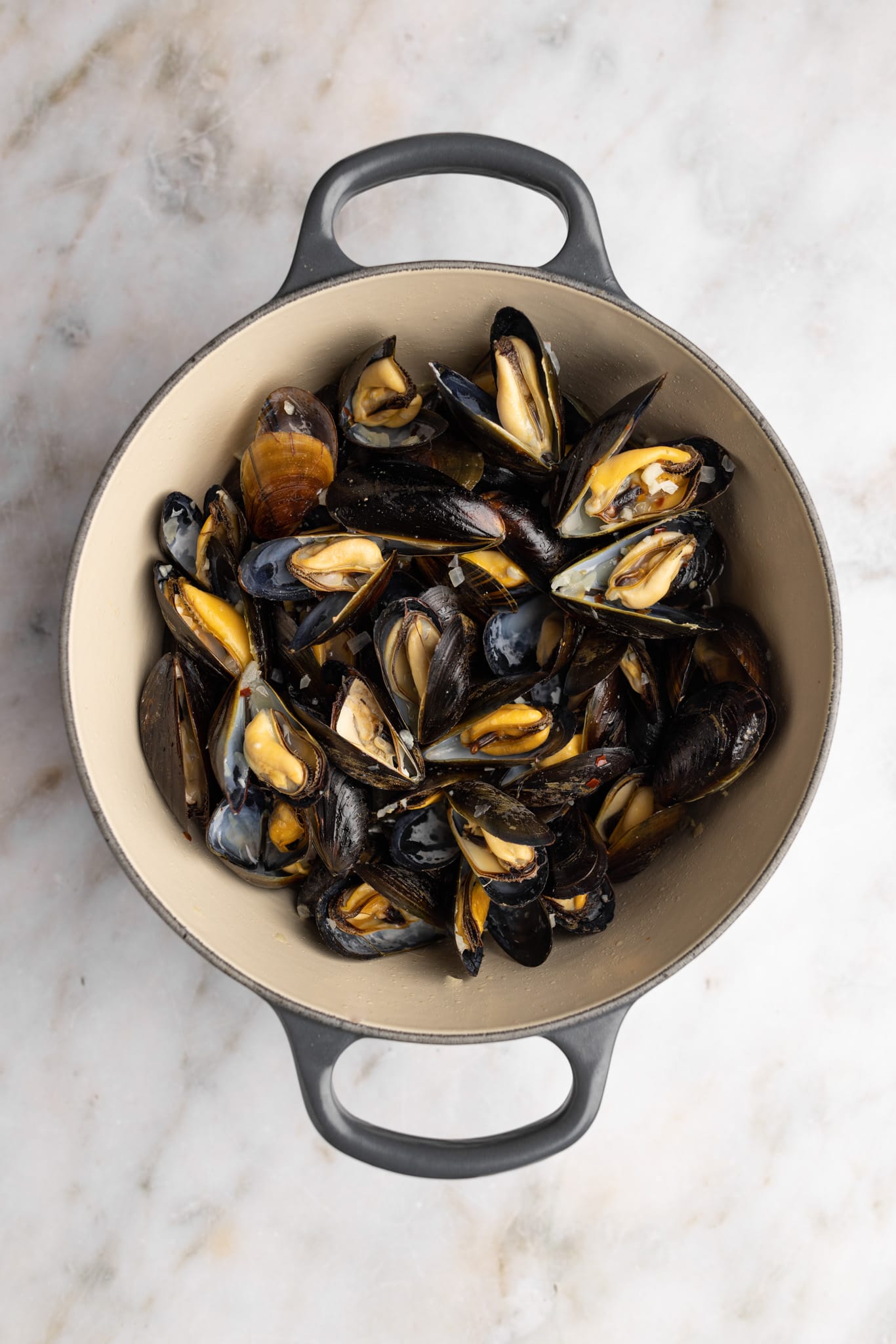 cooked moules frites in a dutch oven