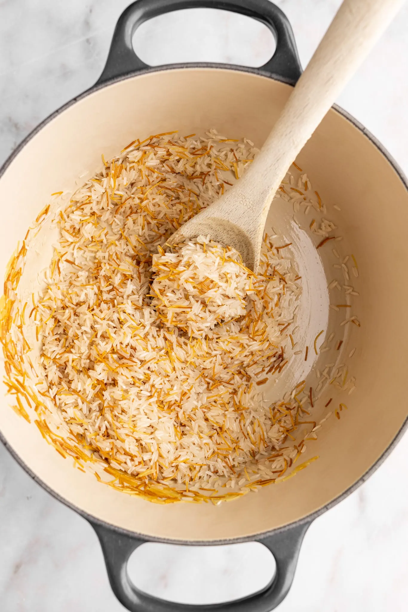 step by step: toasting the vermicelli with rice