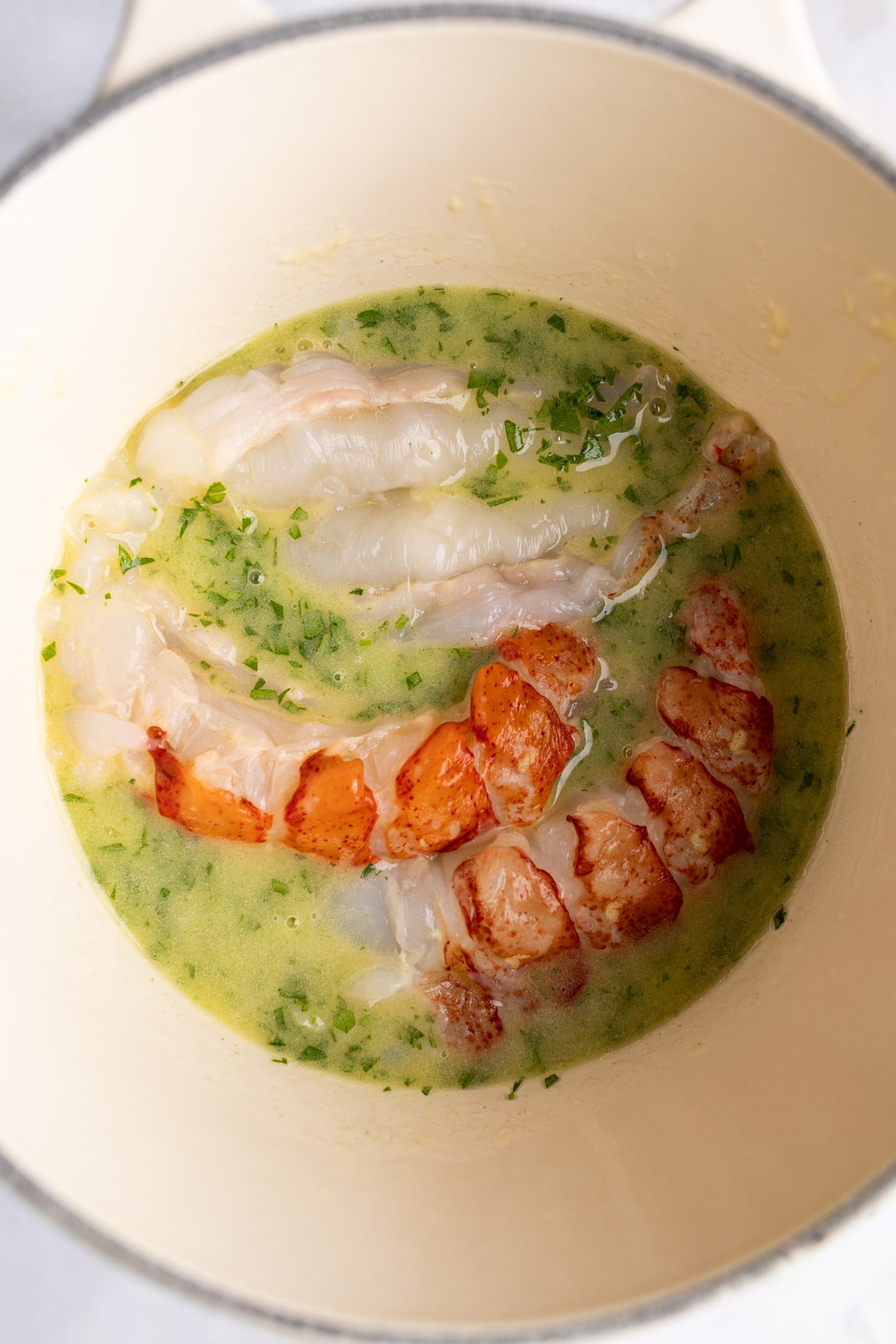 lobster tail meat in parsley butter - uncooked
