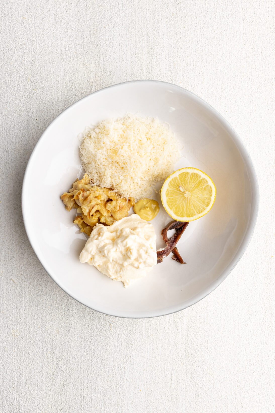 components and ingredients that go into the roasted garlic caesar dressing.