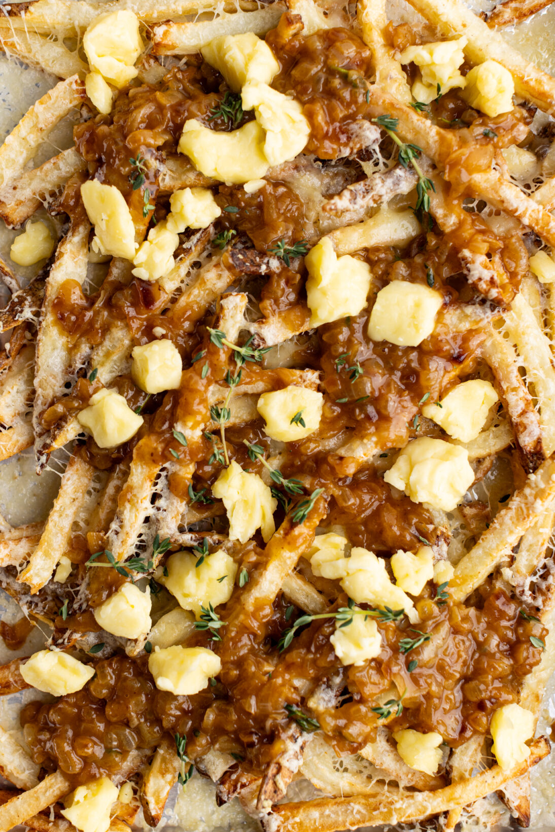 French onion fries covered in melty cheese, french onion gravy, cheese curds and thyme