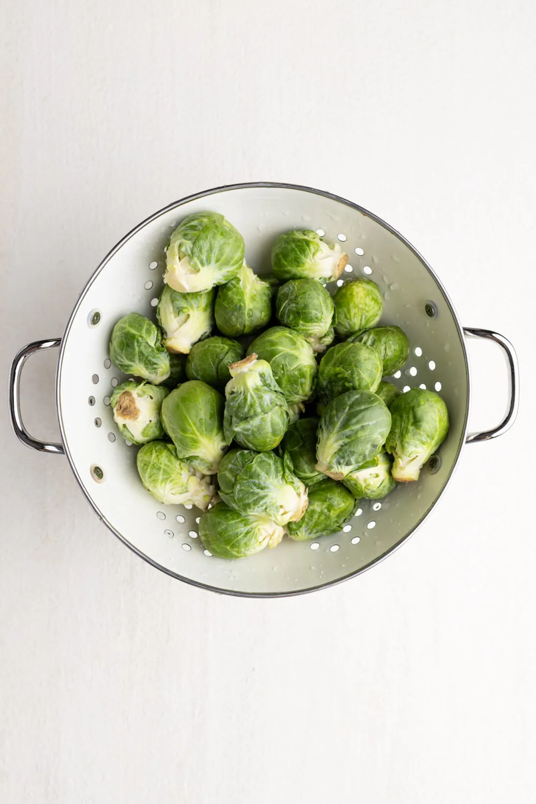 raw Brussels sprouts in a colander 