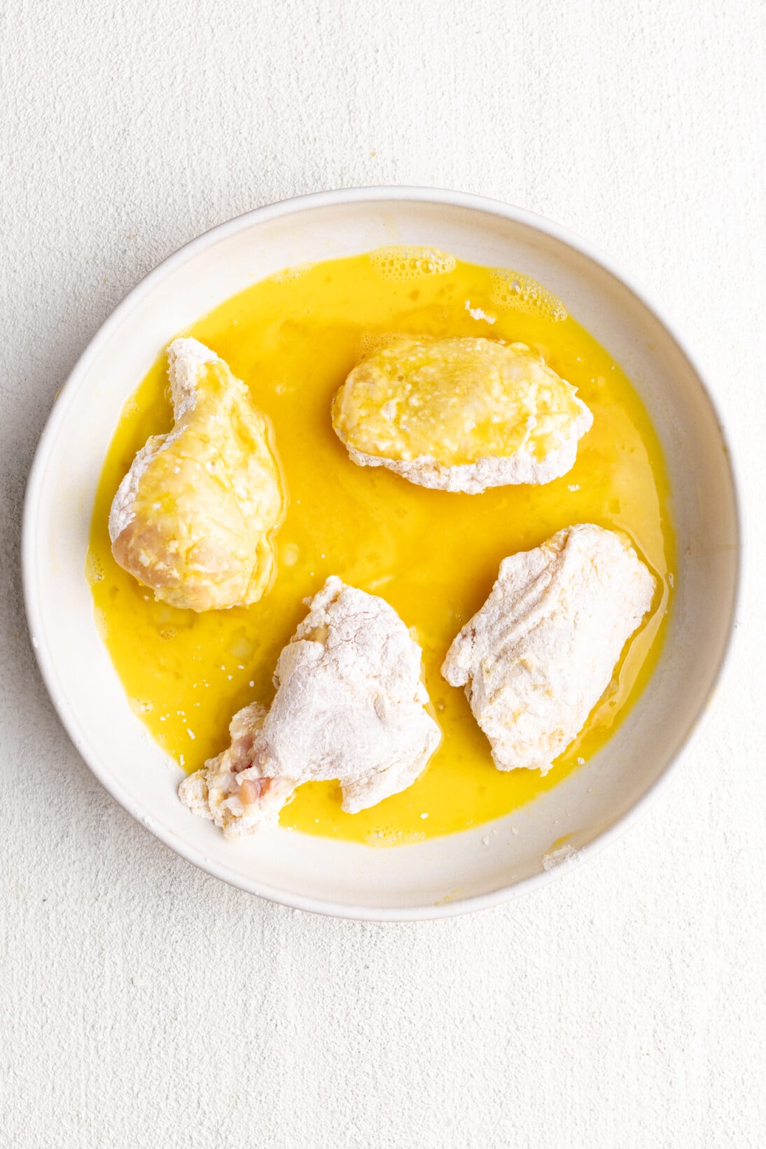 flour cornstarch coated wings getting coated in egg again