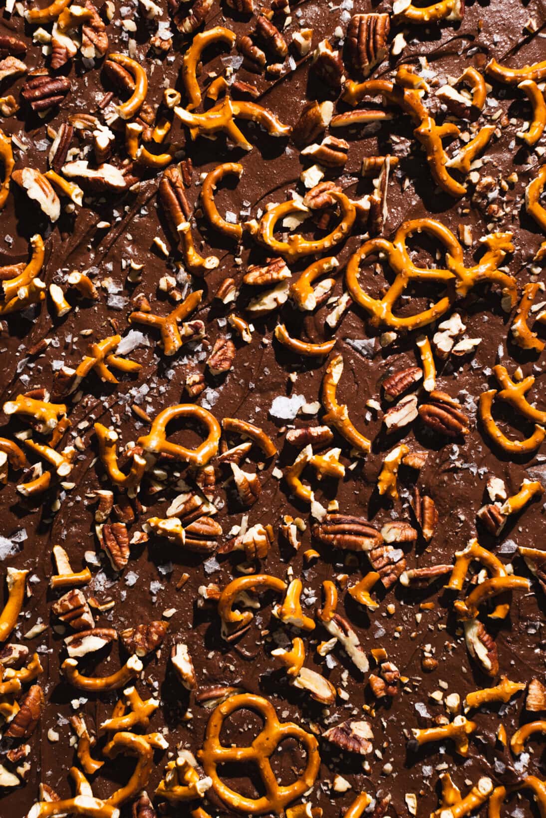 saltine toffee topped with pretzels, pecans, and sea salt. 
