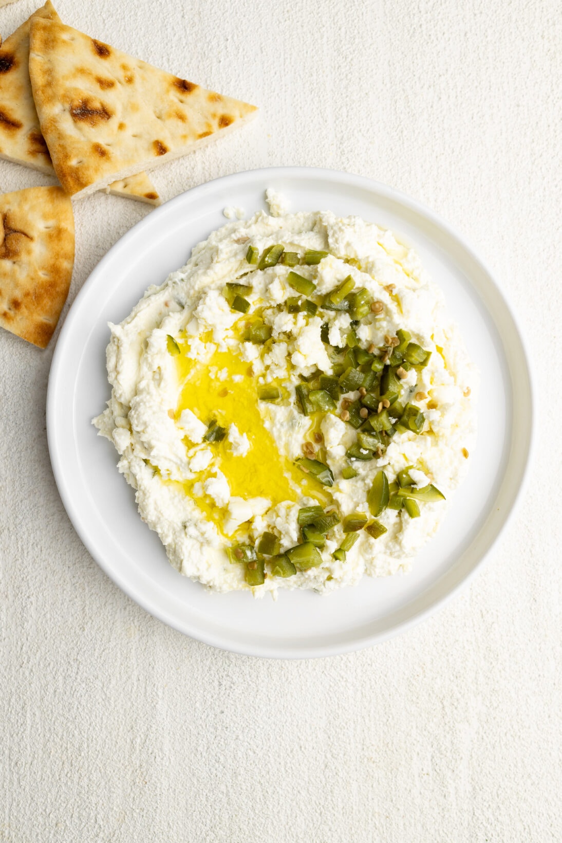 crazy feta dupe garnished with diced jalapeños on top