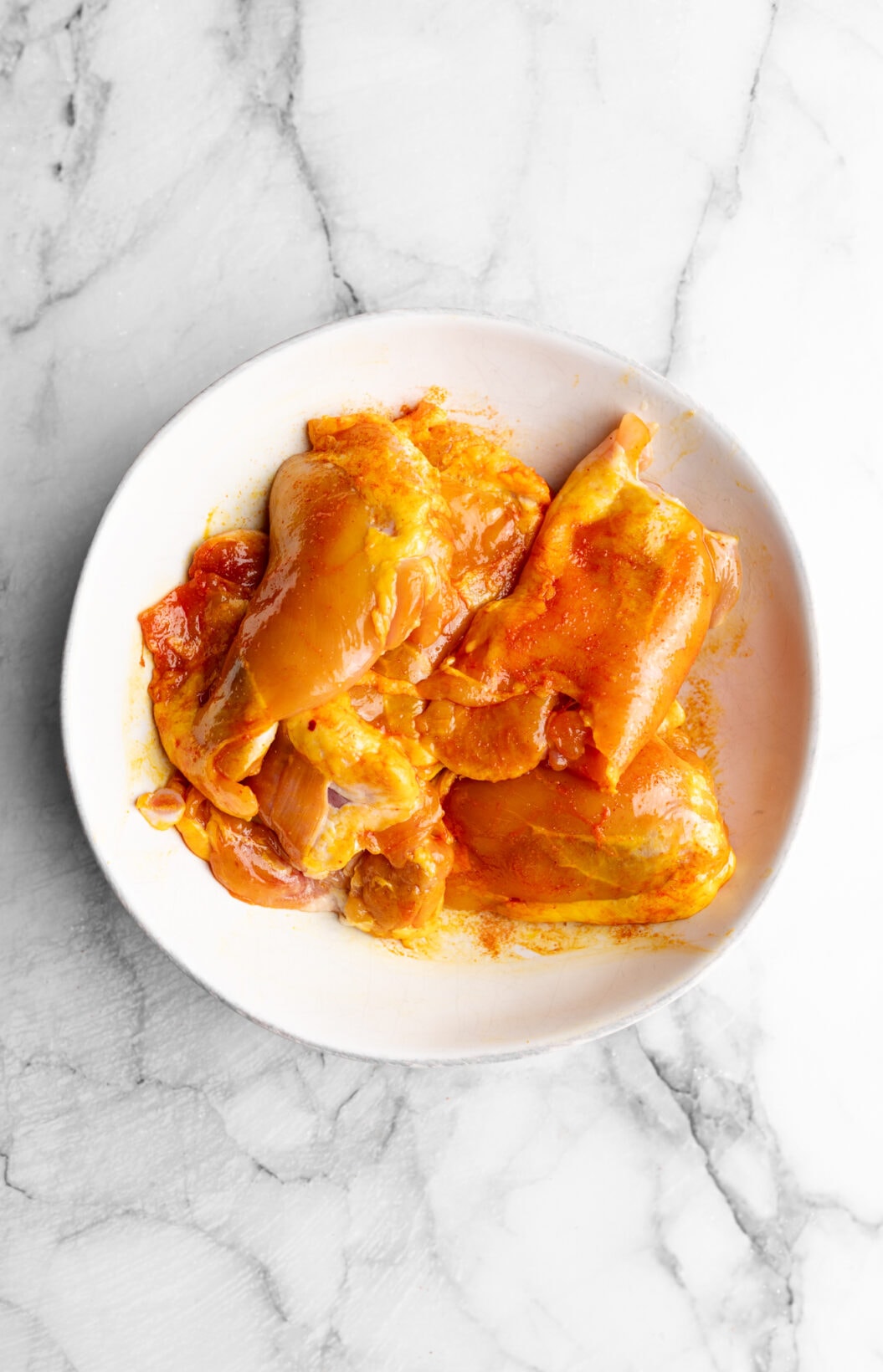 chicken thighs covered in sazón