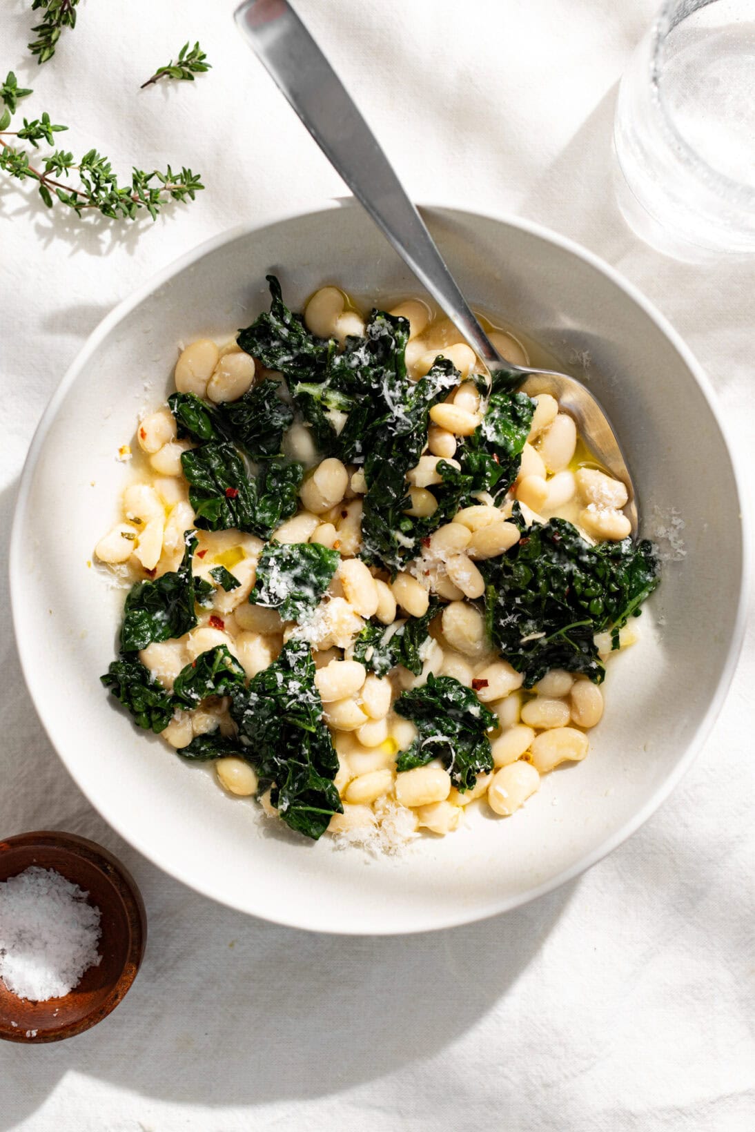 bowl of brothy beans and greens 