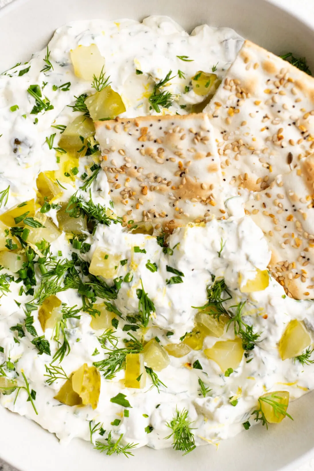 up close shot of the dip with the everything flatbread crackers in the bowl.