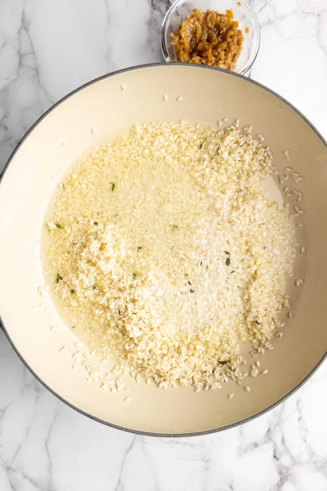 deglazing the pan with white wine
