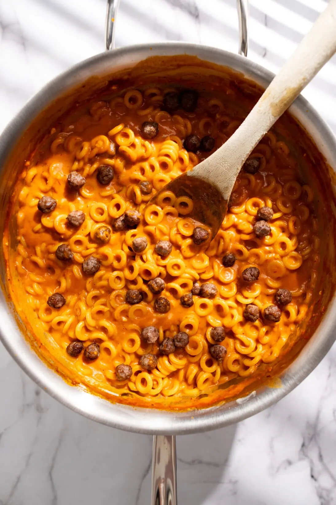 pan of finished homemade spaghettios with mini meatballs