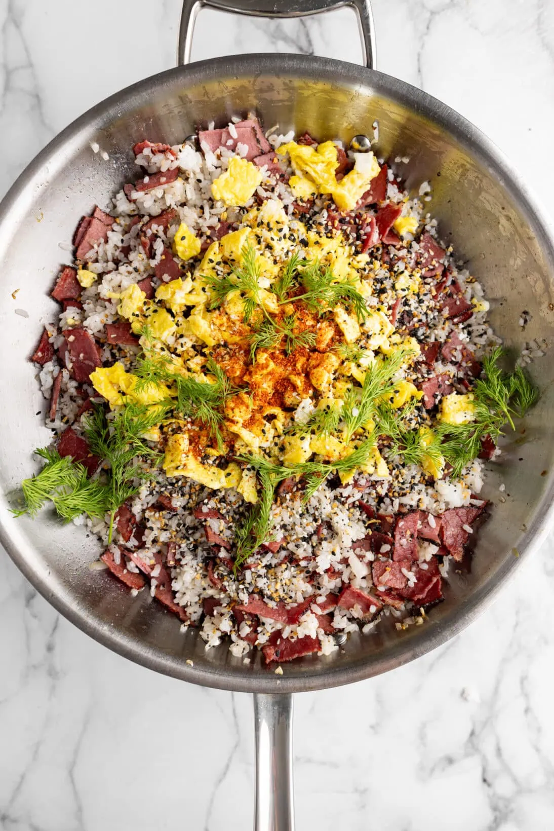 step by step photos: added the egg, dill, and chili to the pastrami fried rice.