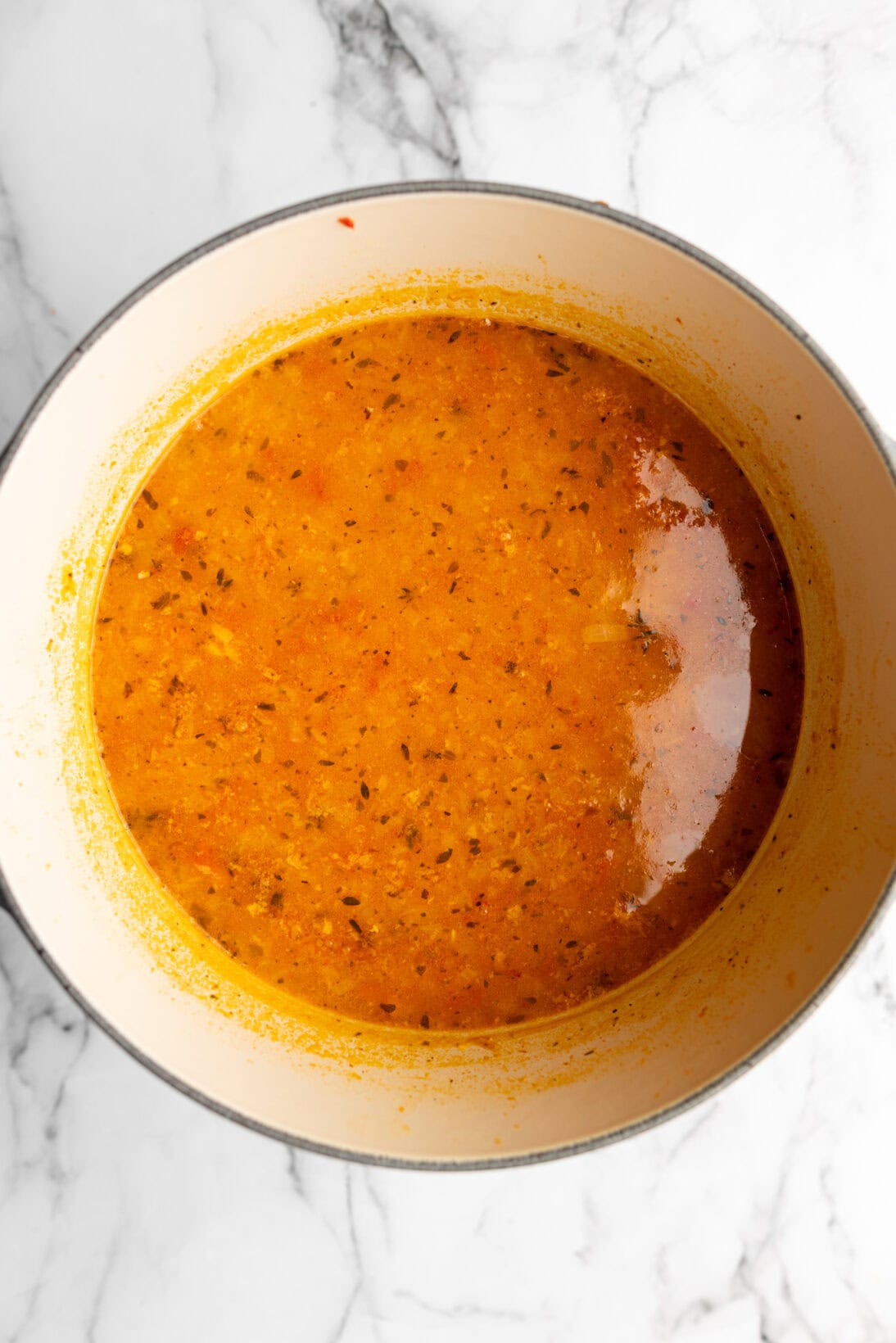 soup step by step: added the broth and parmesan rind