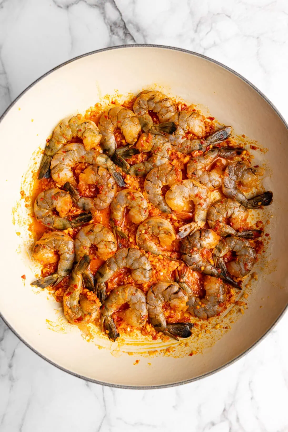 cooking the shrimp in the braiser