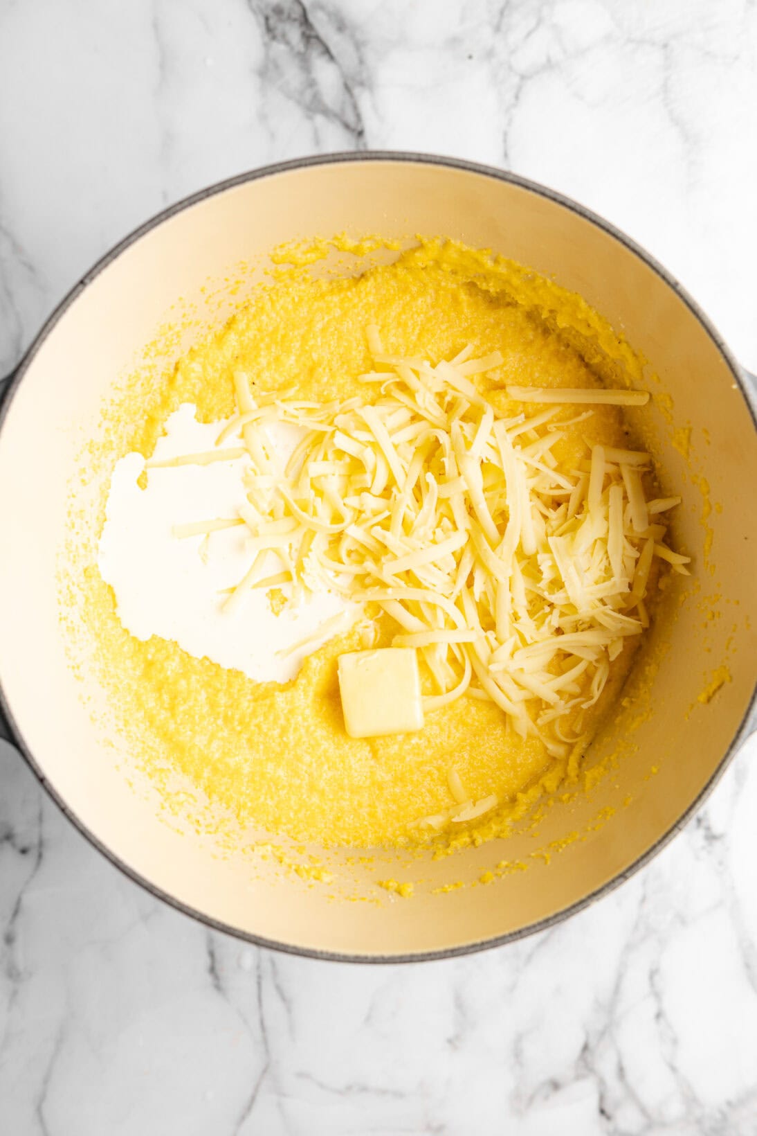 cooked polenta with heavy cream, a slab of butter, and cheese added
