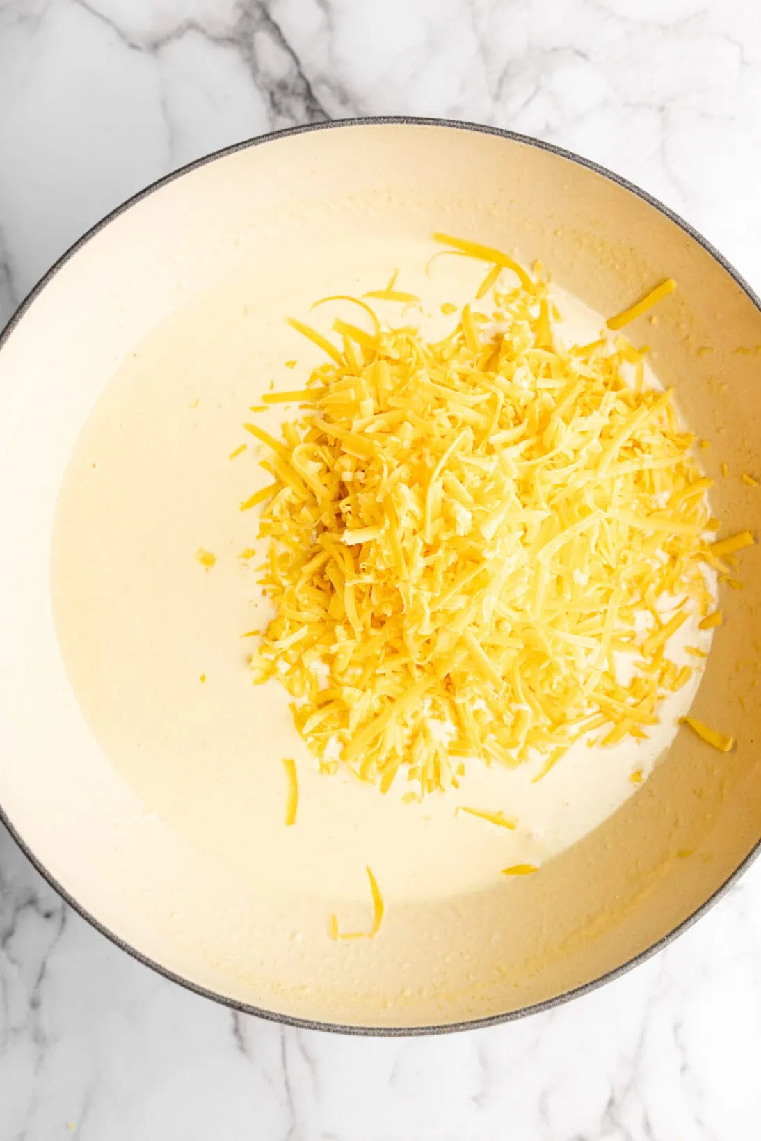 step by step process: adding the cheese.