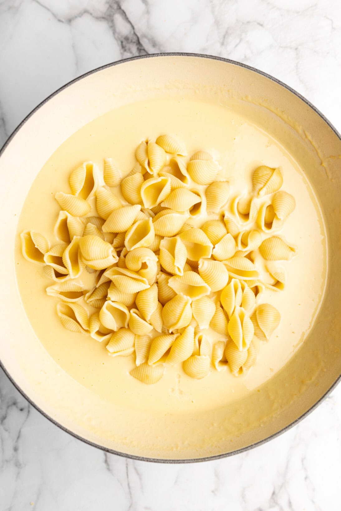 step by step process: adding the pasta to the sauce