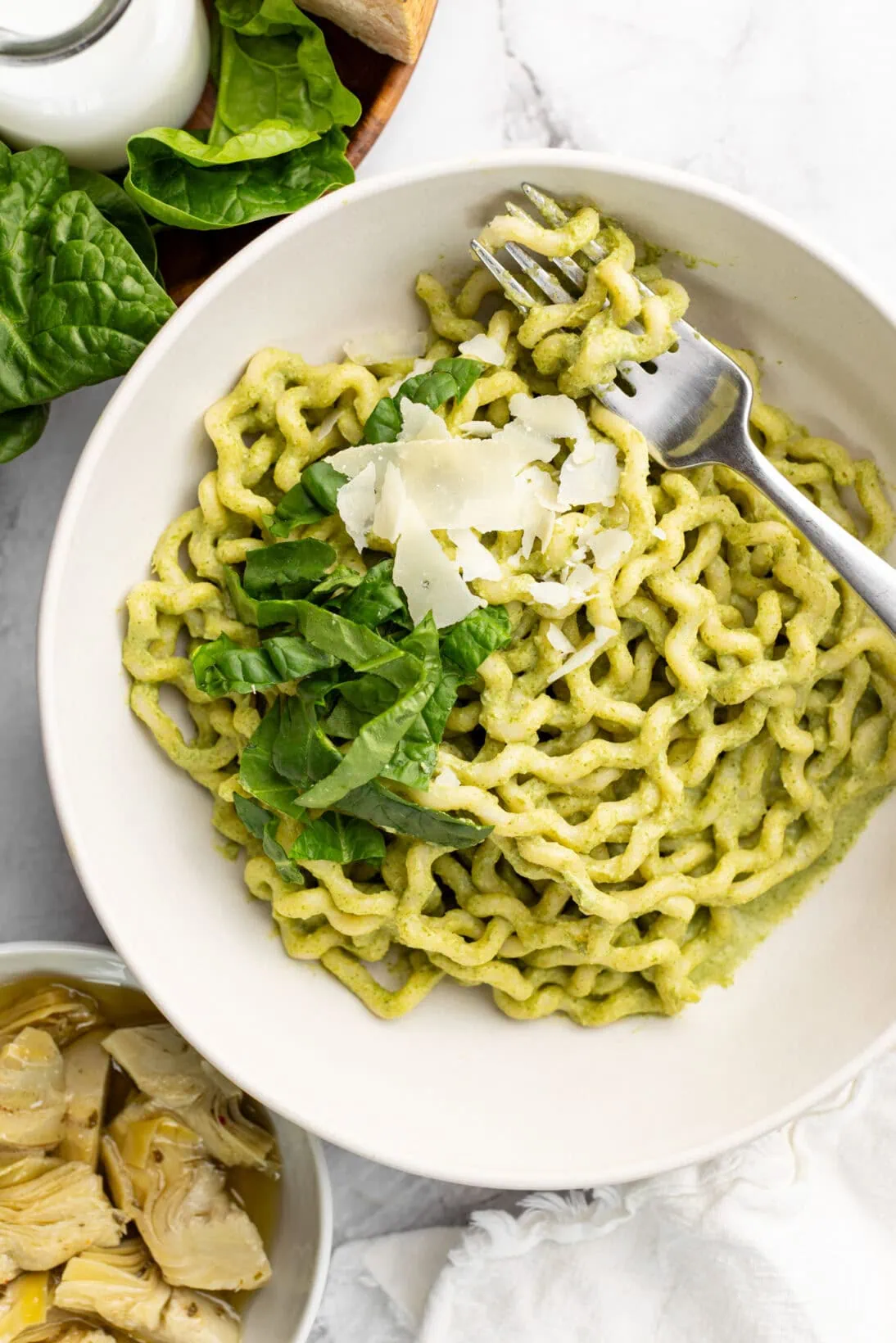 a bowl of artichoke and spinach pasta