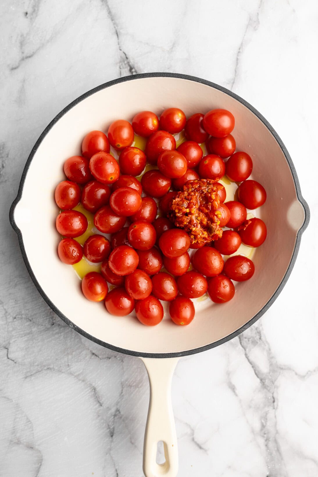 raw tomatoes coated in EVOO and Calabrian chilis