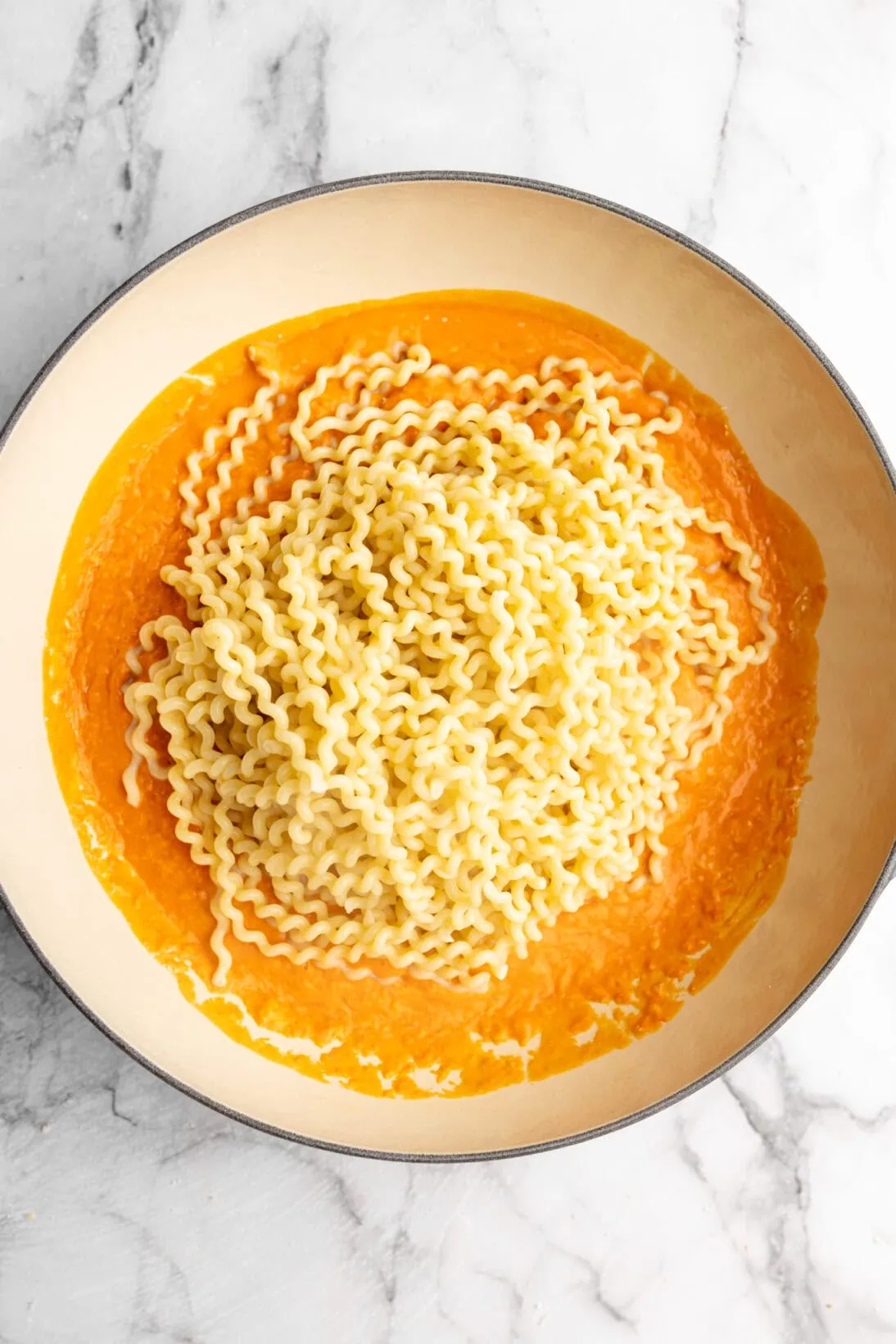 pasta added to the sauce
