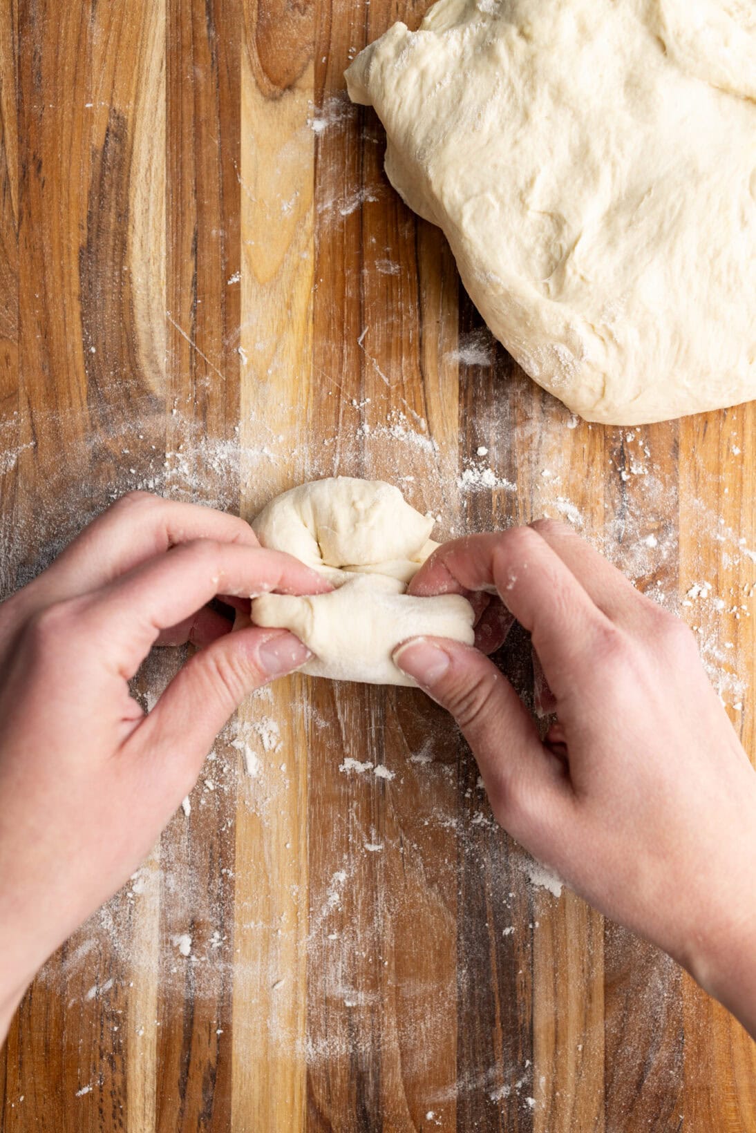 rolling the dough into a ball by hand.