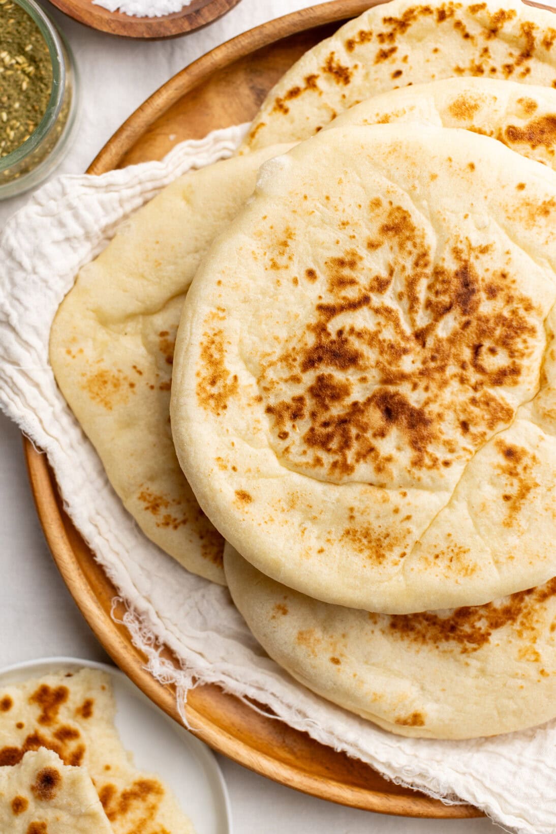 a plate of chewy homemade pita bread