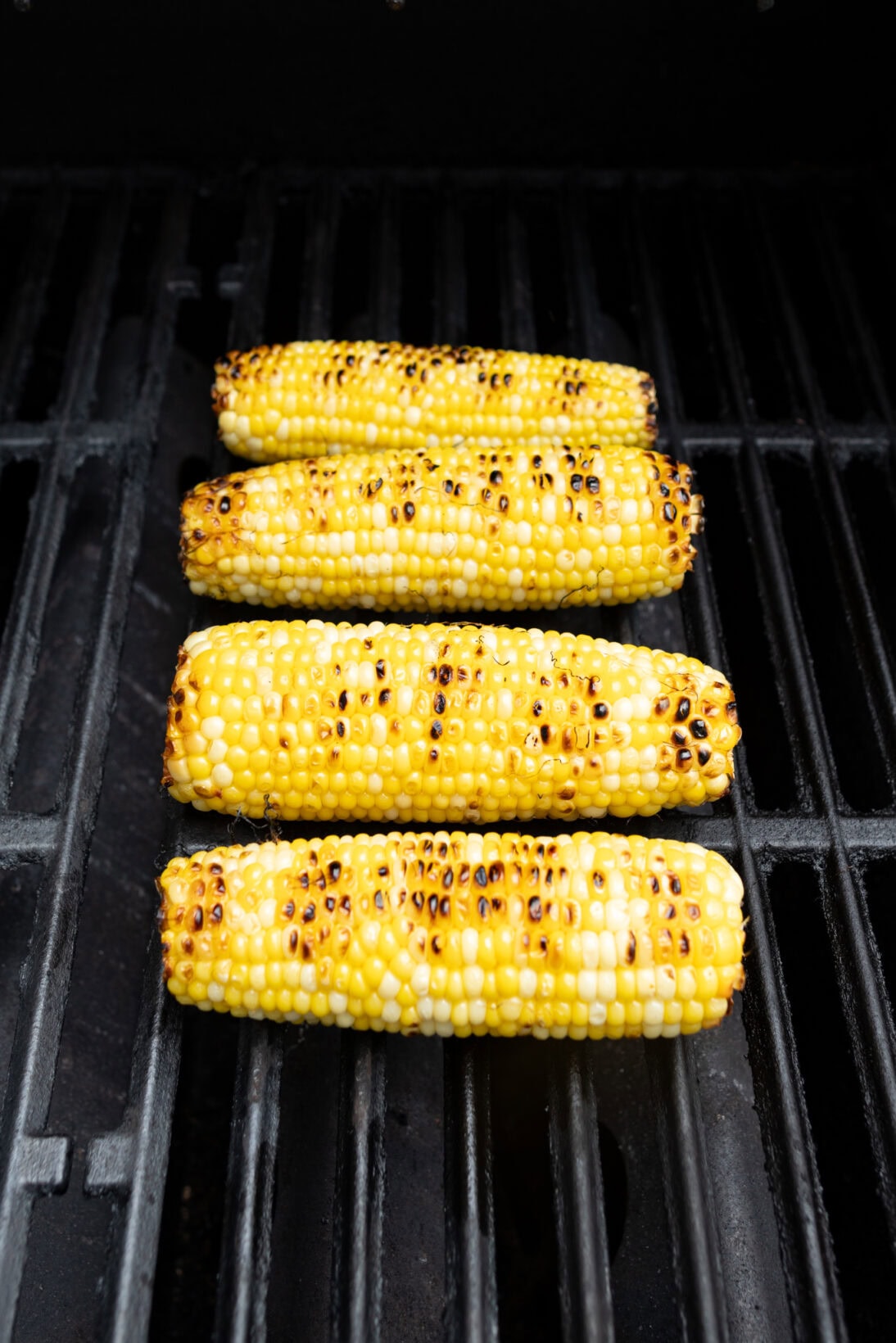corn cooking on the grill
