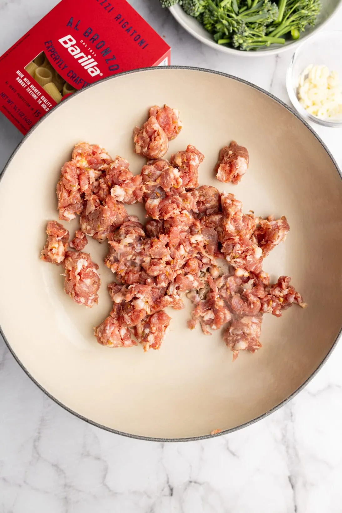 raw Italian sausage cooking off