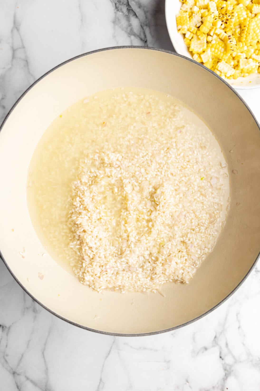 first round of broth added to the pan