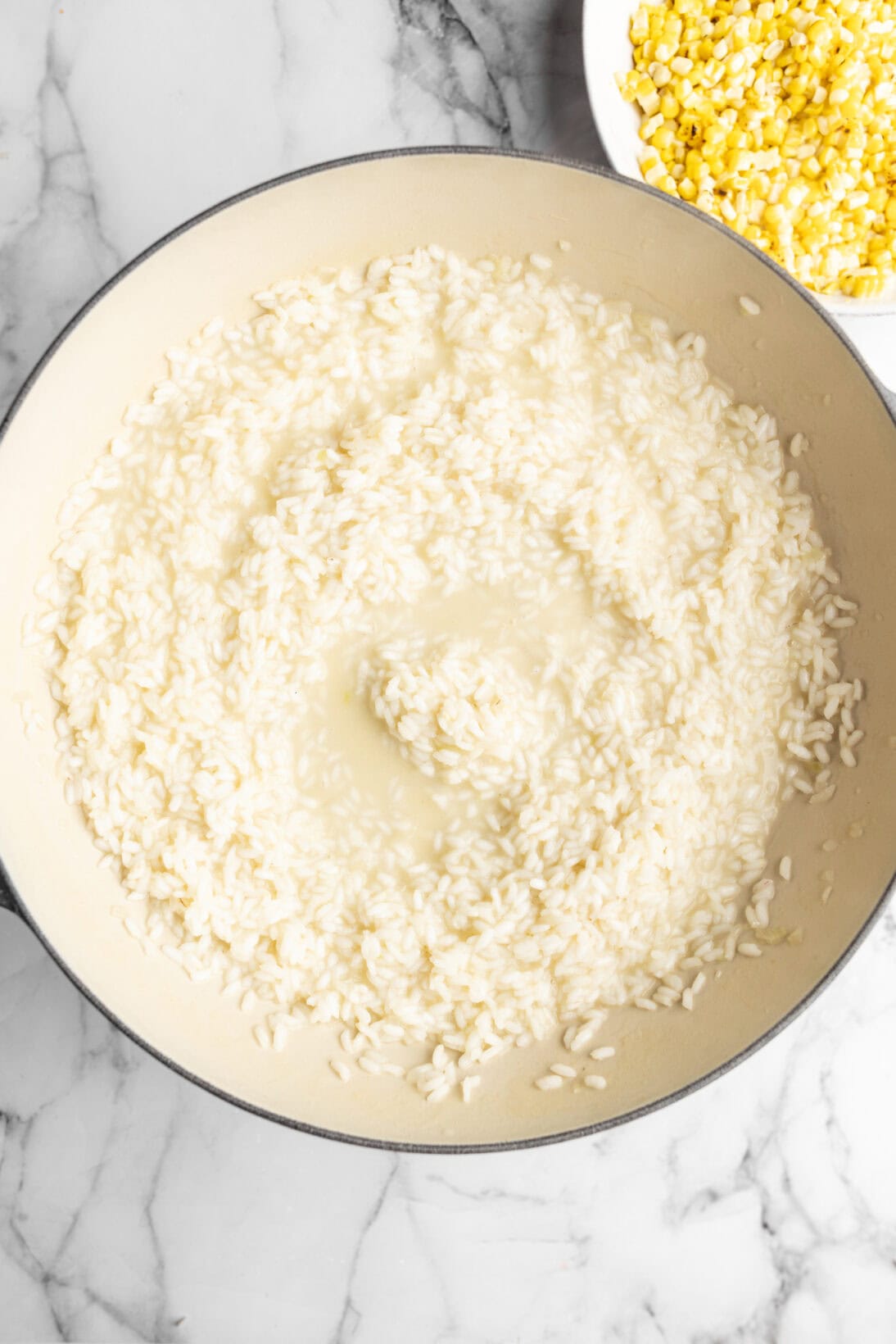 cooking the risotto adding broth slowly.