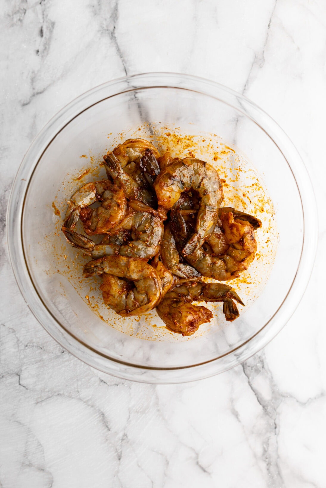 marinating peri-peri shrimp in a bowl