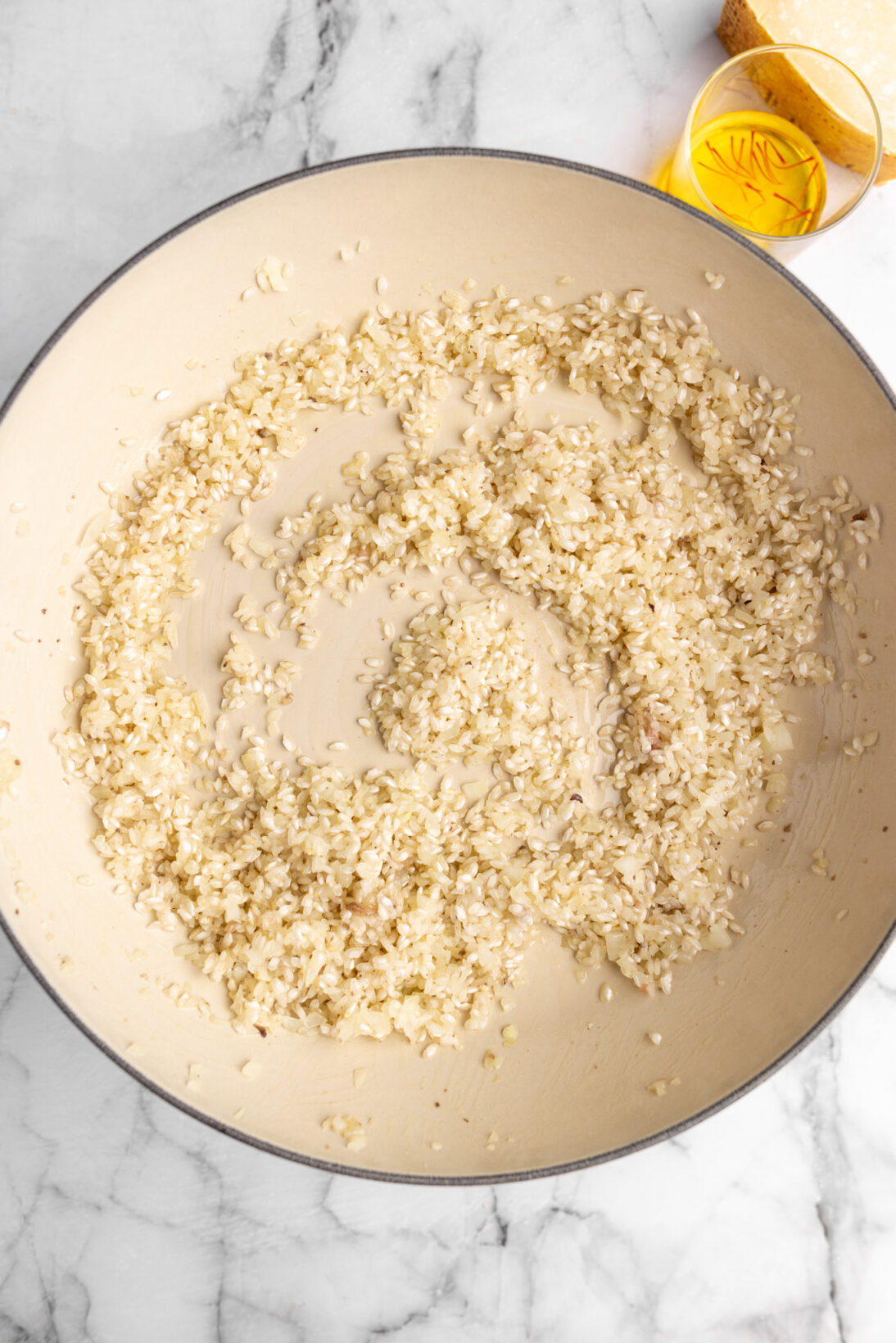 cooking risotto alla milanese - toasting the arborio rice