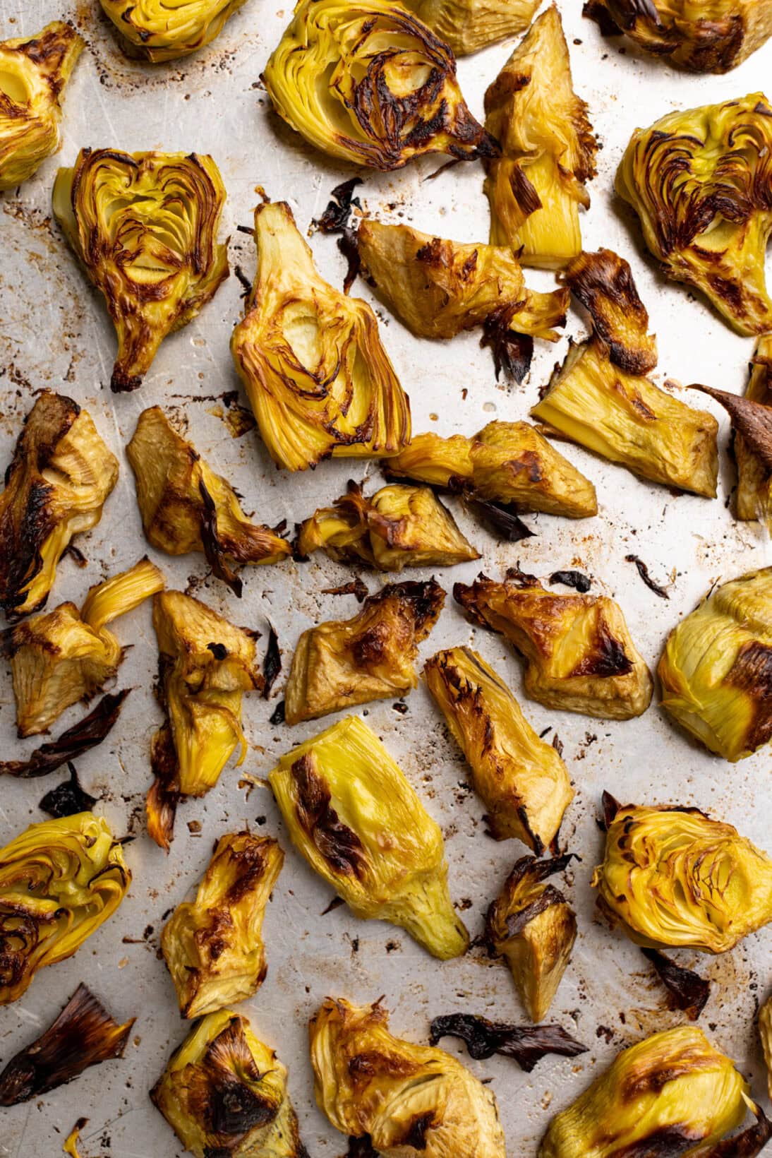 roasted canned artichokes on a sheet pan.