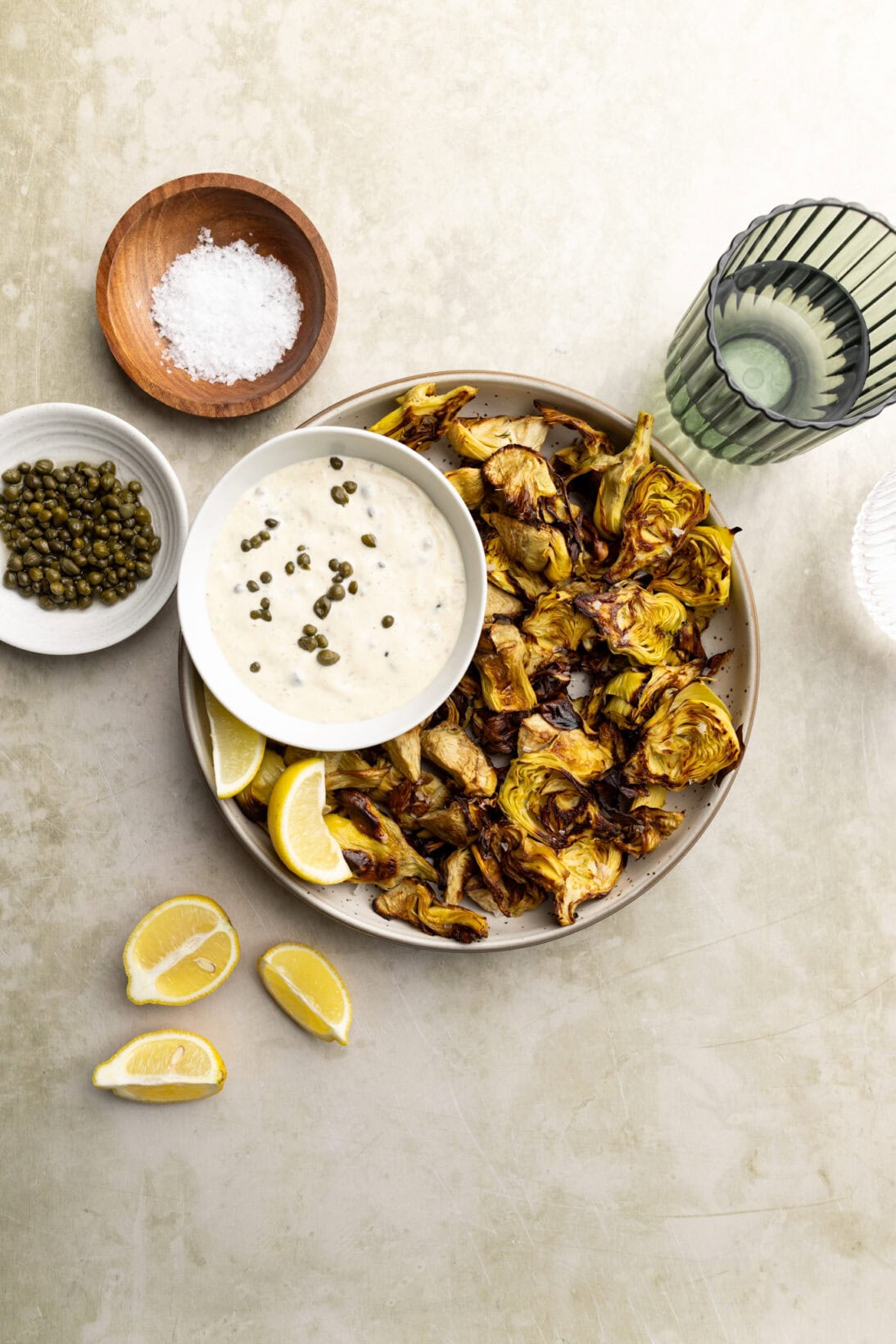 a bowl of crispy artichokes with a lemon caper aioli