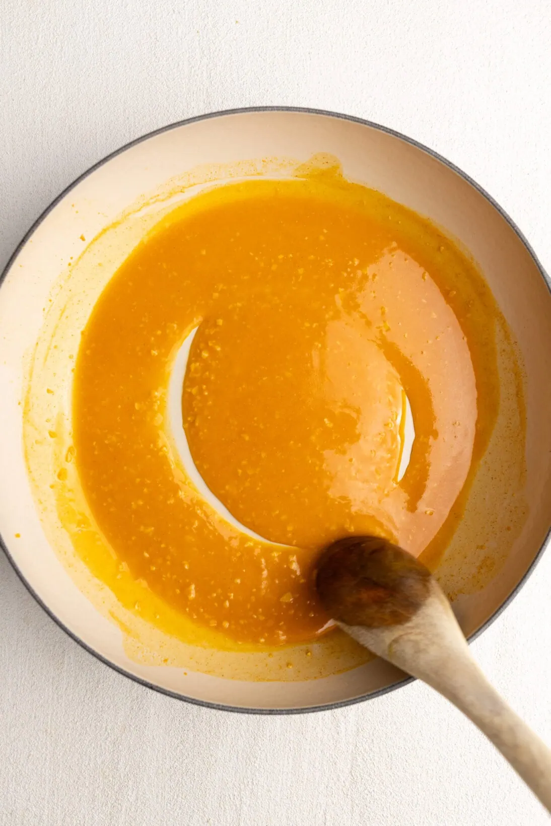 cooking the broth for a few minutes until it can coat the back of a spoon