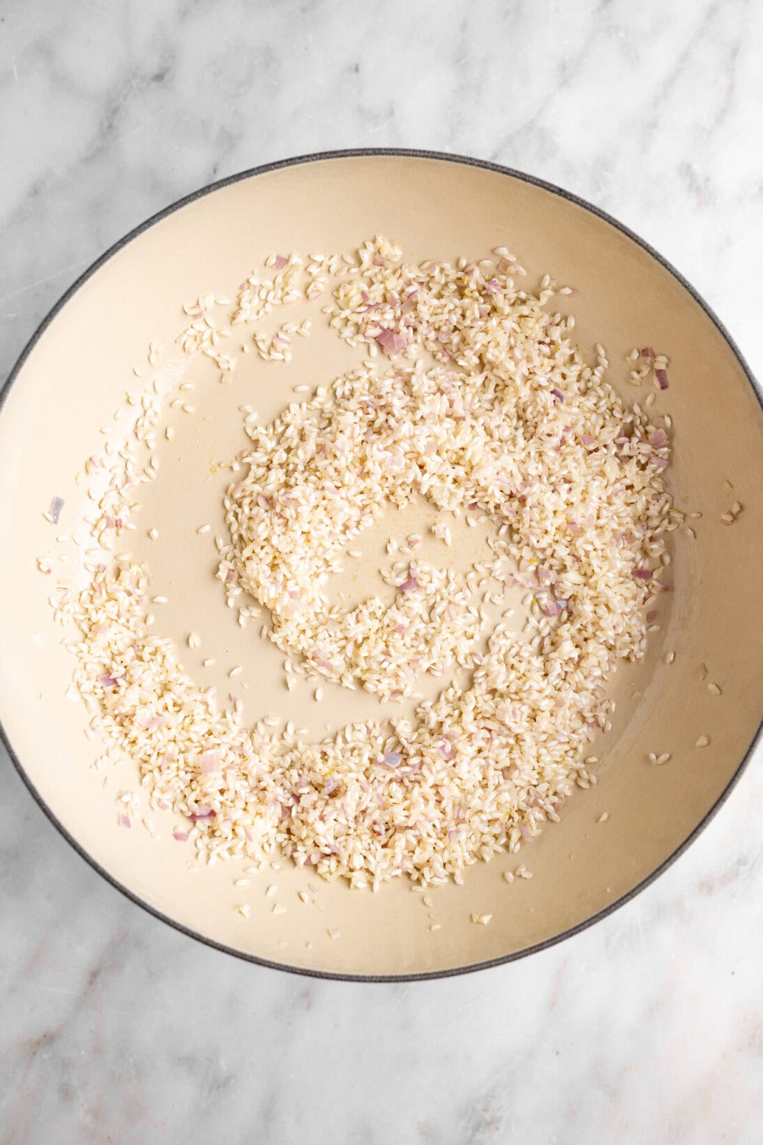 making risotto: toasting the rice.