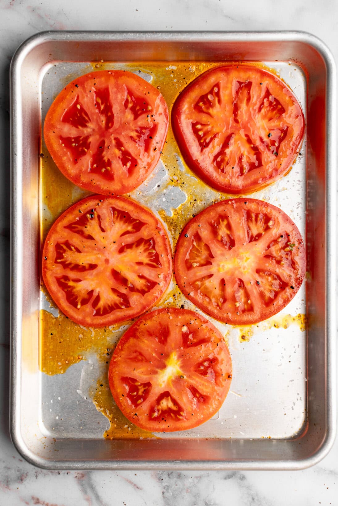 sliced tomato ready to be roasted.
