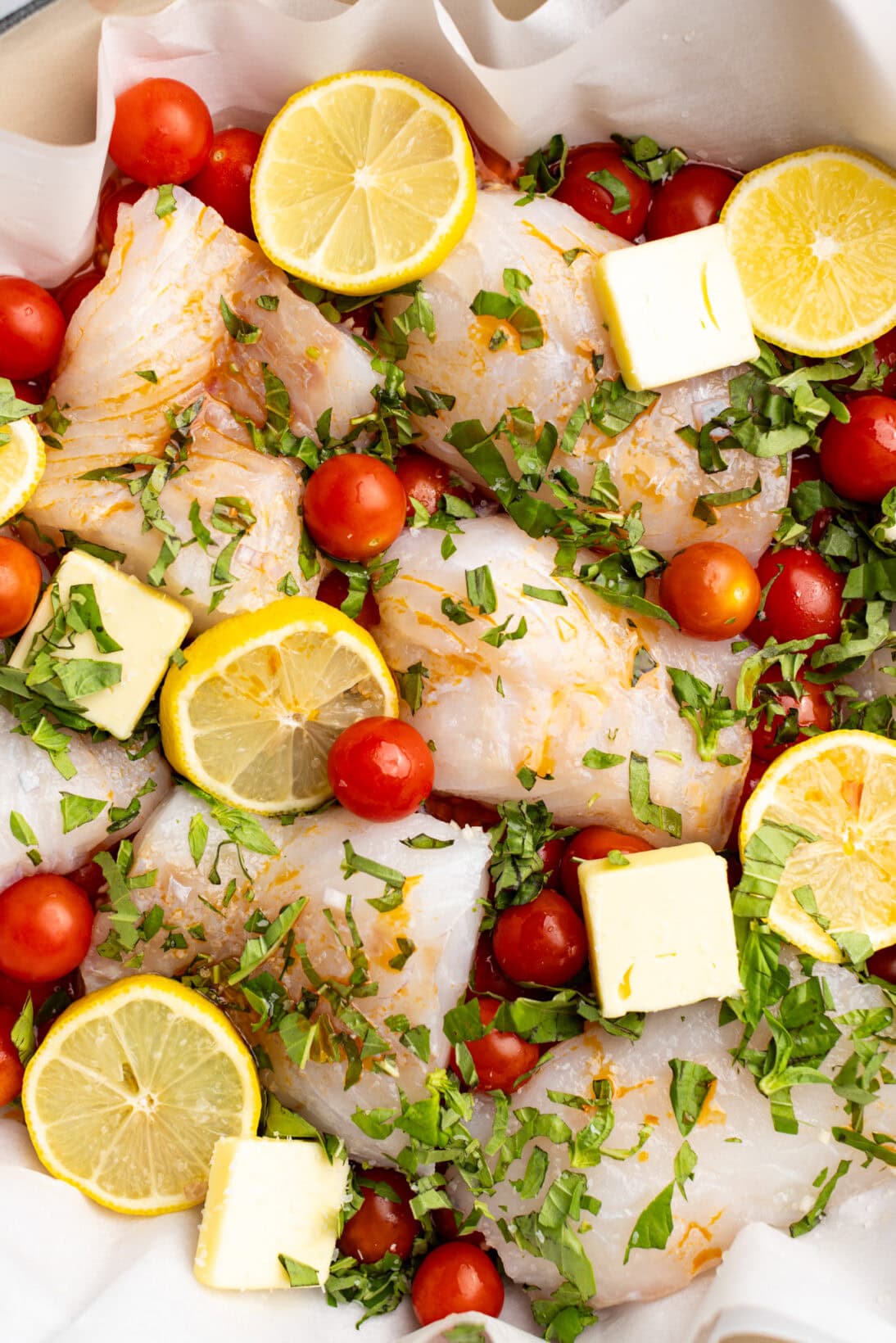 uncooked up close tomato poached cod