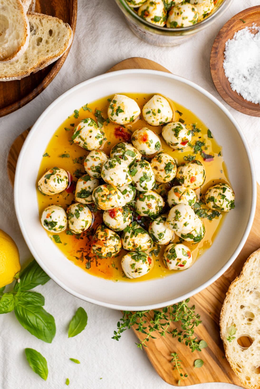 a bowl of marinated mozzarella balls