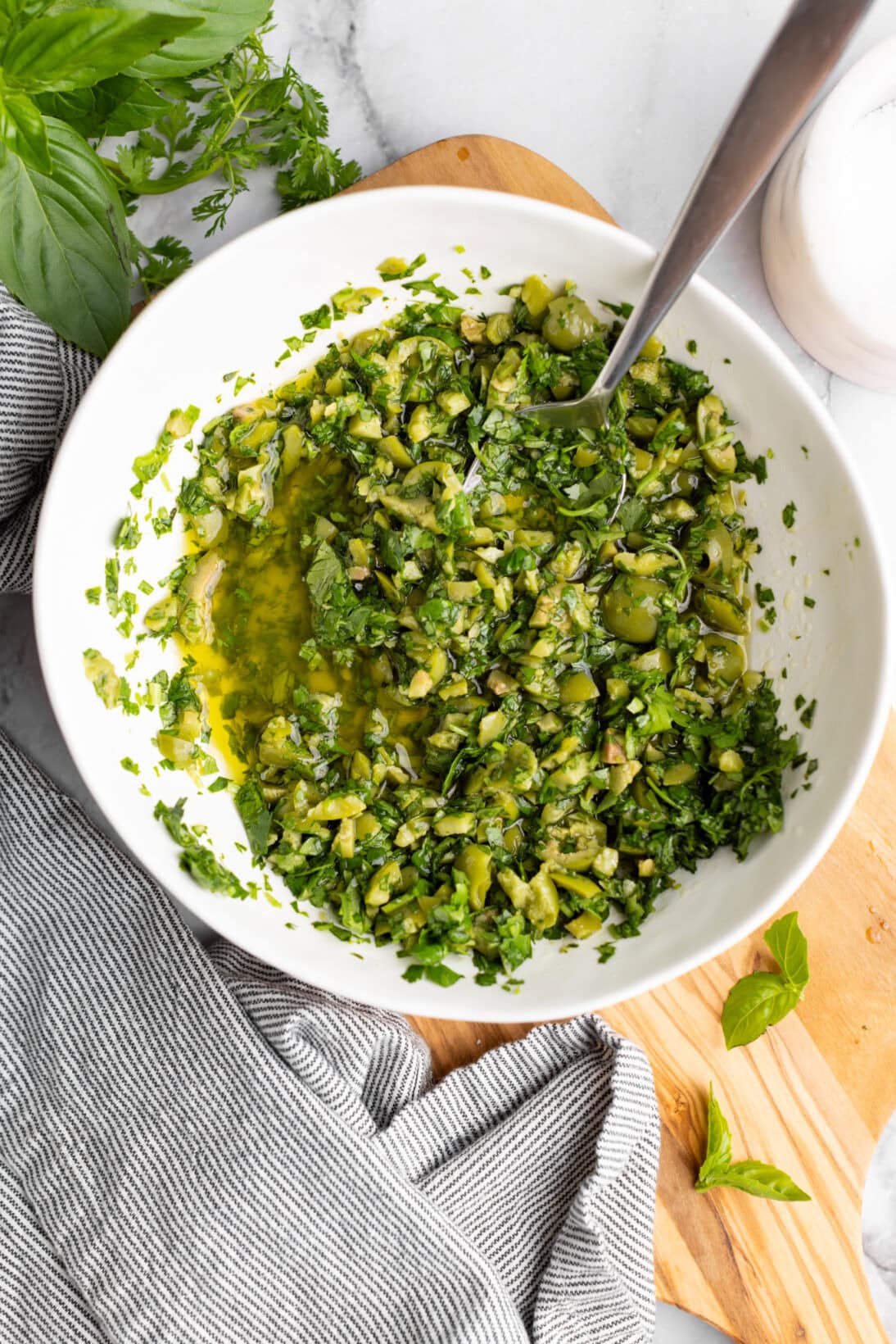 the green olive herb dressing in a bowl.