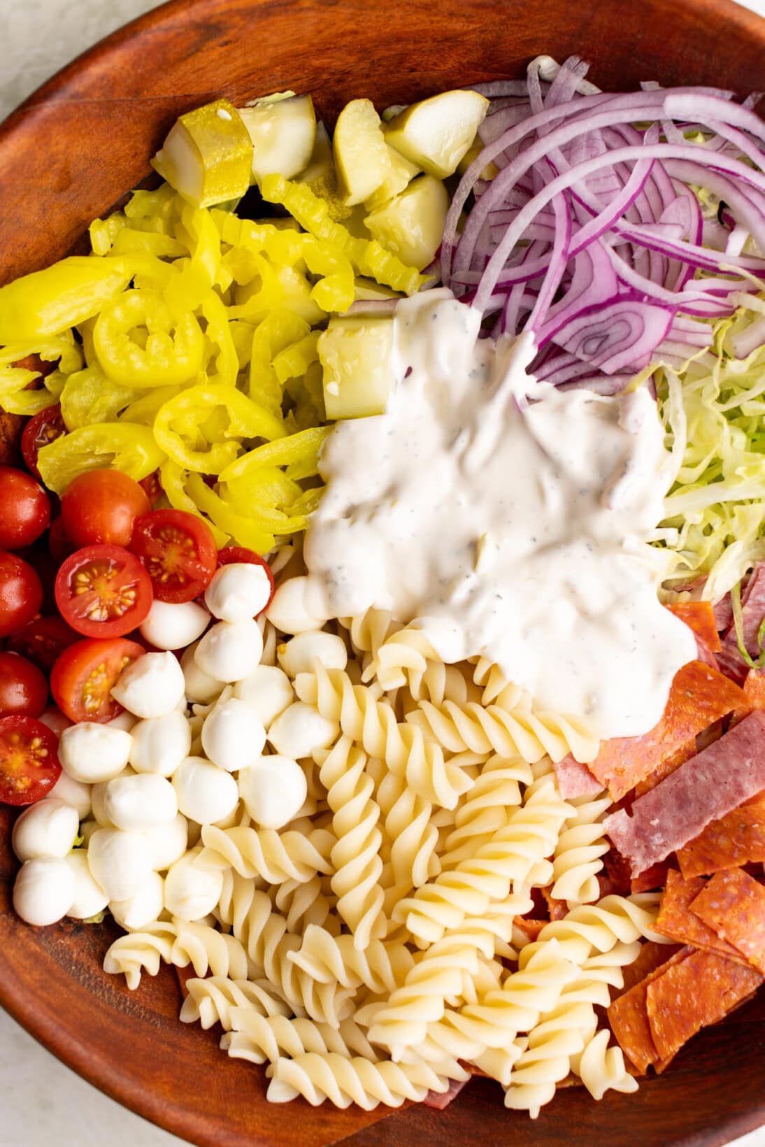 up close grinder pasta salad with dressing on top
