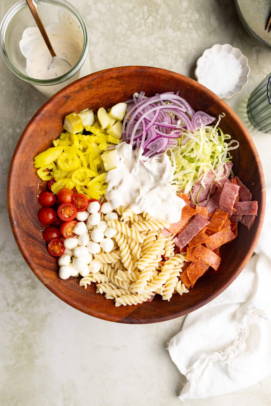 grinder pasta salad in a wooden bowl.