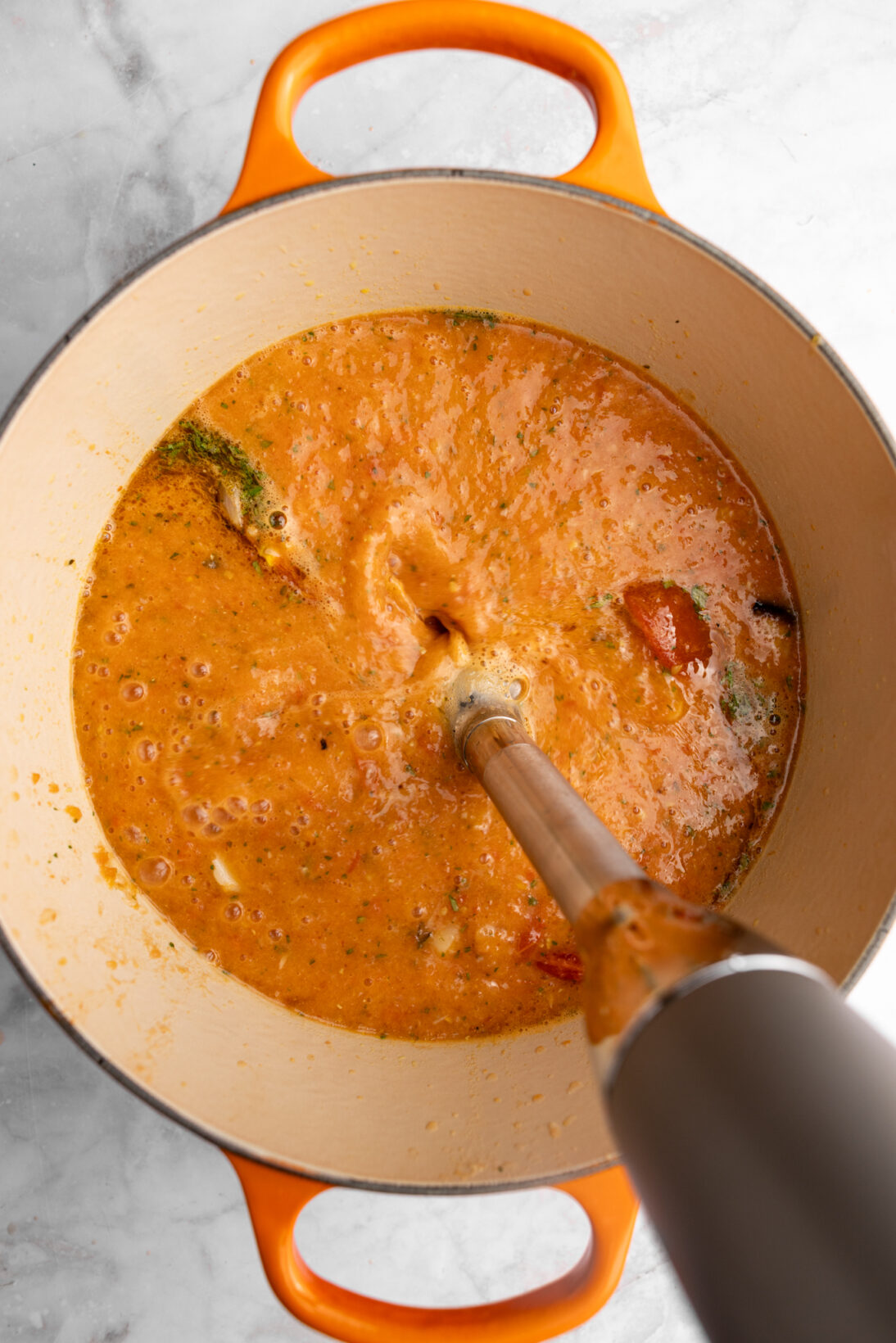 blending the ingredients  with an immersion blender