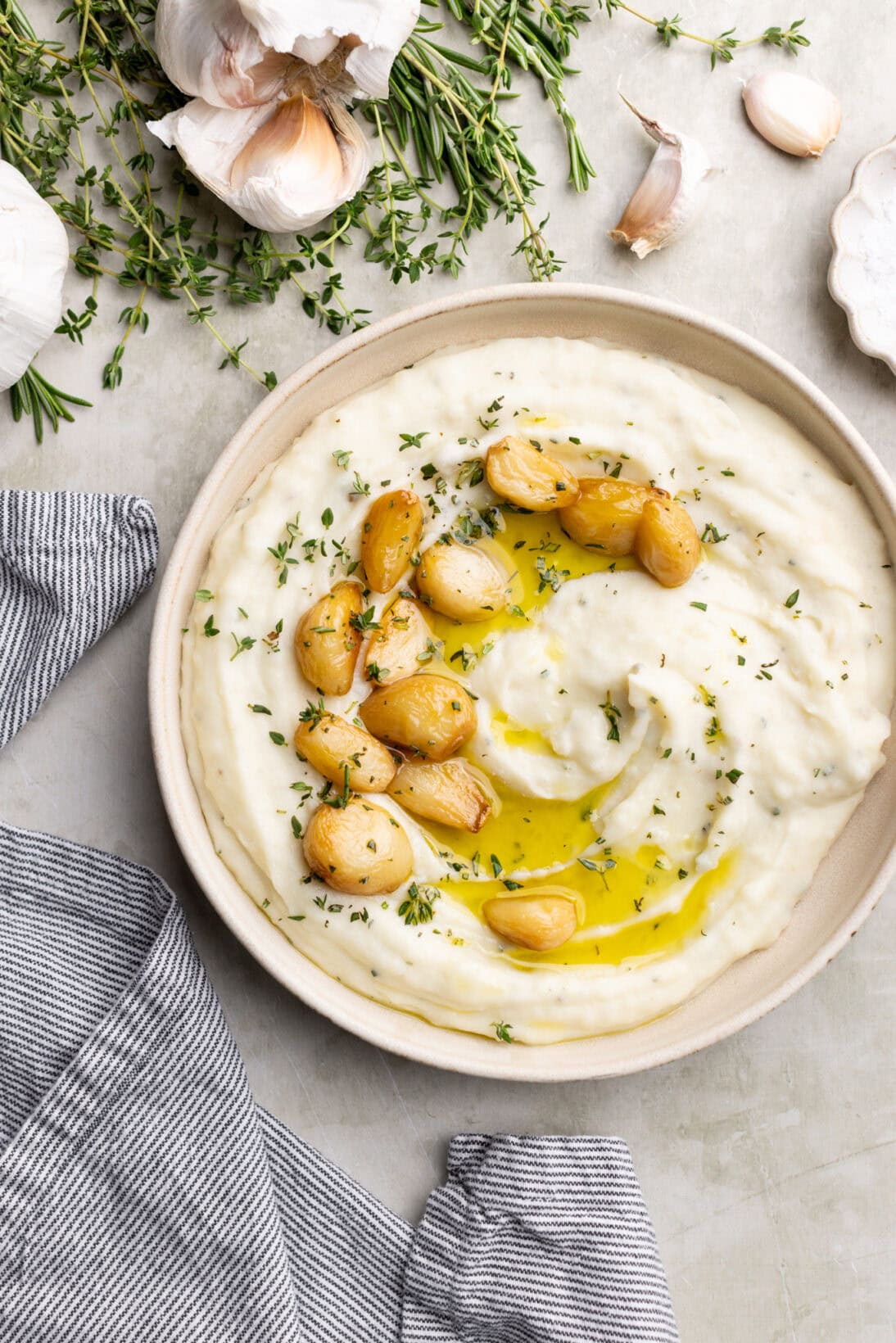 garlic and herb mashed potatoes with extra garlic confit on top