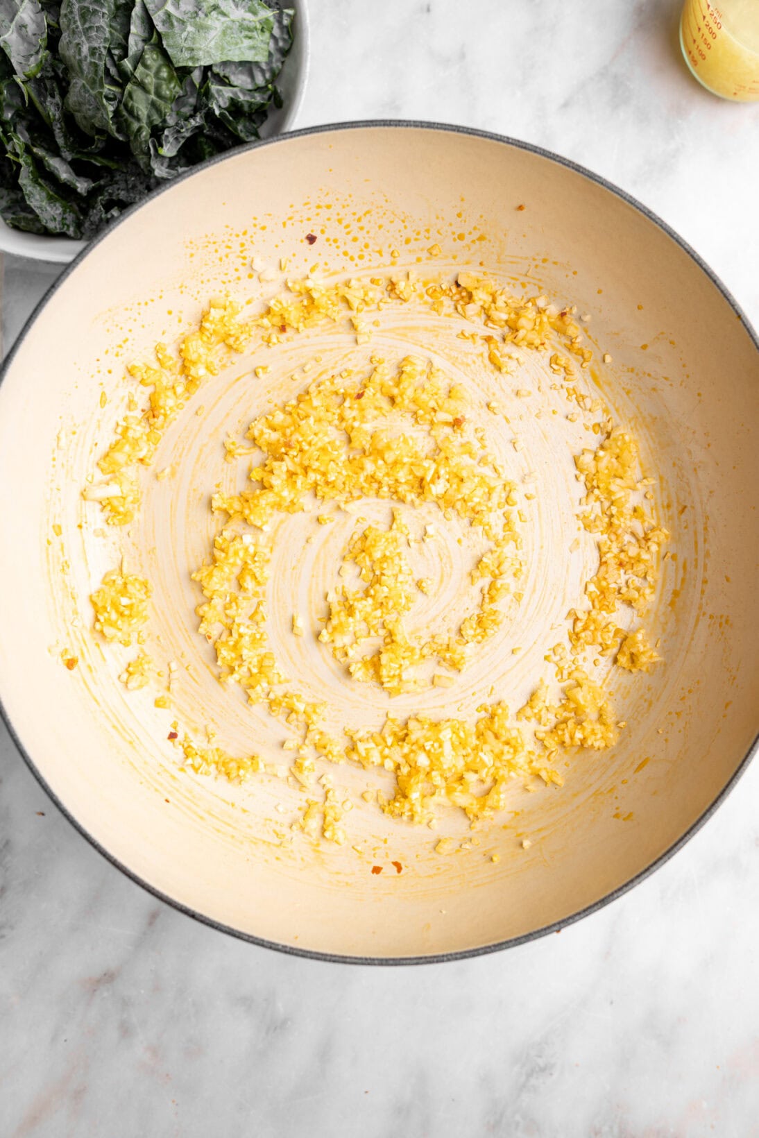step by step photo: sautéing the base, onions and garlic